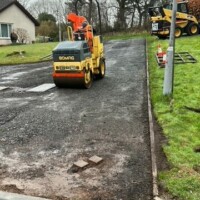 Armstrong's Surfacing Contractors prepping a shared residential driveway in Glasgow for tarmacadam 2024 Residential Driveway upgrade work in Glasgow Scotland