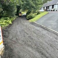 Prepping a rutted roadway for surface dressing in Scotland Prepping a rutted roadway for surface dressing in Scotland