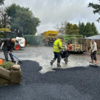 Armstrong's tarmacadam crew working on new driveways in Dalry Scotland KA24
