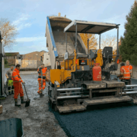 Armstrong's Surfacing paver crew hire Hired Paver crew from Armstrong's Surfacing working with Barber Green machine